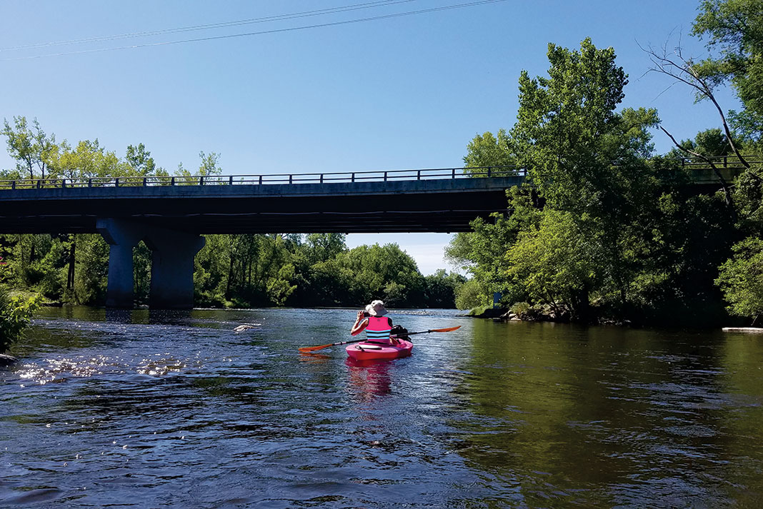 a person kayaking on the Rum River in Minnesota