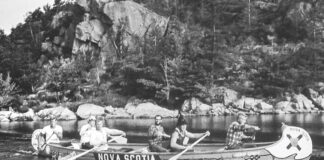 a group of men participate in a canoe expedition marking Canada's centennial in 1967