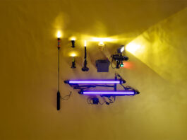 a selection of kayak lights laid out on a yellow backdrop