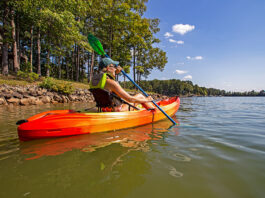 woman paddling the Perception Tribe 9.5 recreational kayak