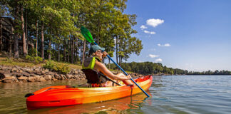 woman paddling the Perception Tribe 9.5 recreational kayak