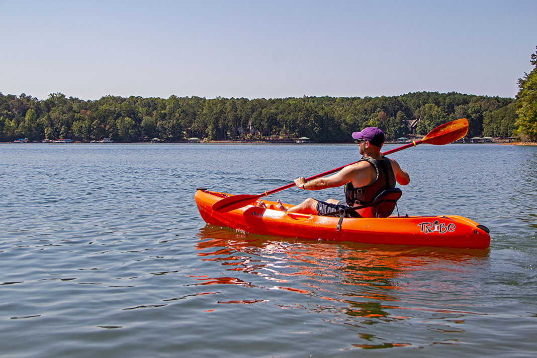 man paddling the Perception Tribe 9.5 recreational kayak, Clemson special edition