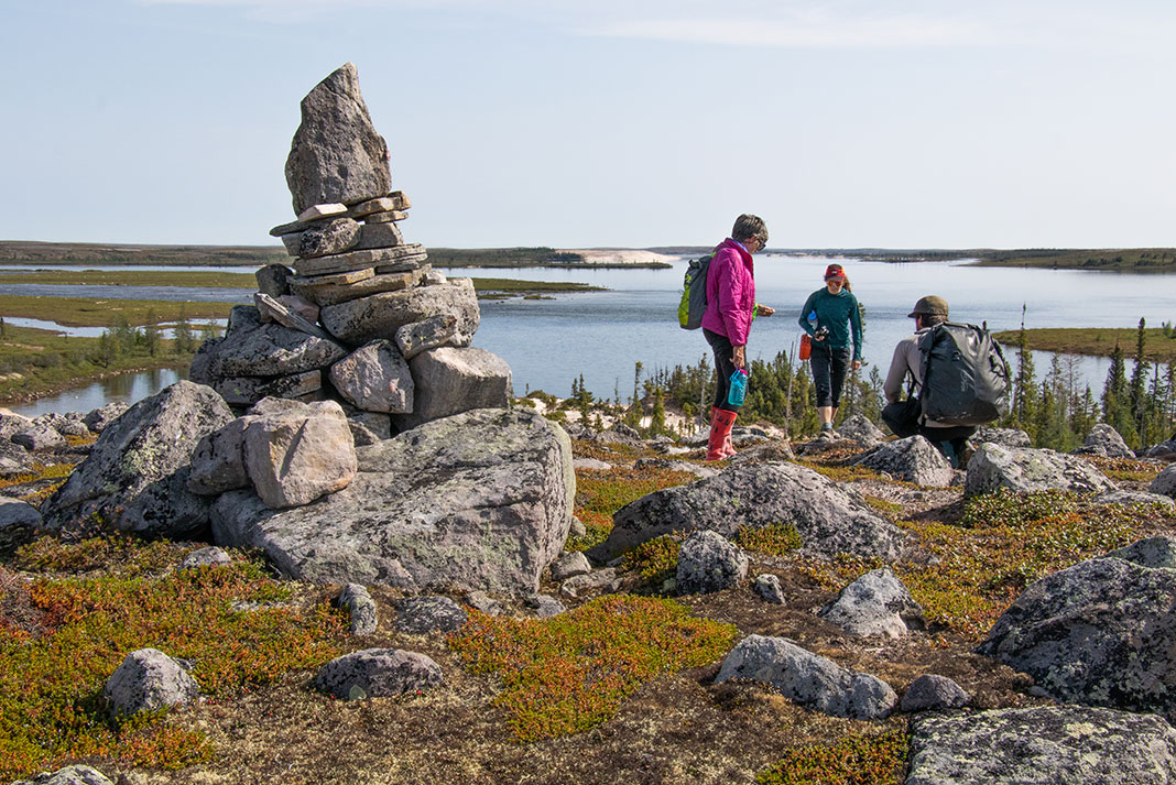 hikers visit a cairn built by Canadian geologist JW Tyrrell