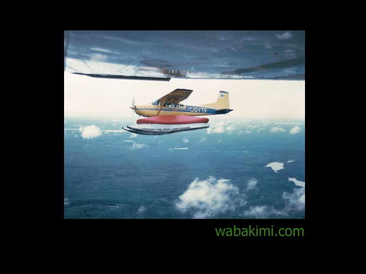 bushplane flying with canoe strapped to it Wabakimi.com