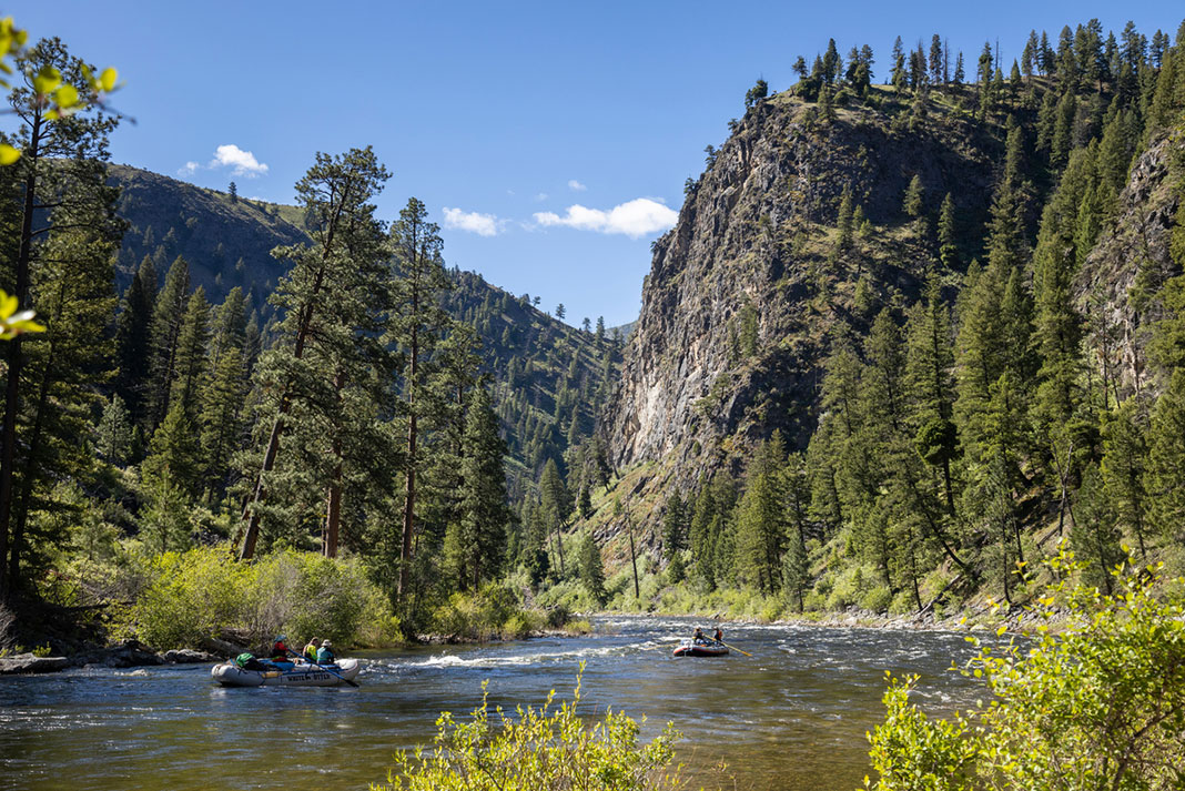 two boats full of rafters paddle down the Middle Fork Idaho's Salmon River