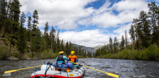 two rafters paddle down the Middle Fork of the Salmon River