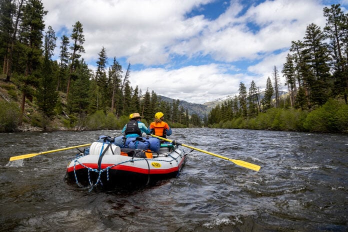 two rafters paddle down the Middle Fork of the Salmon River