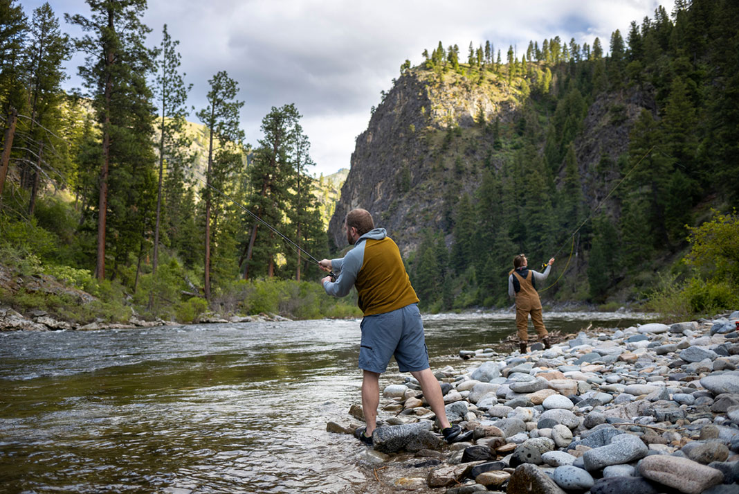 man and woman fish on the banks of the Salmon River