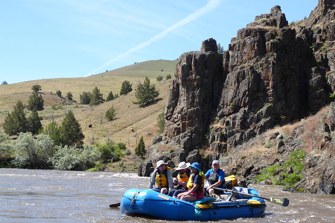 a raft full of people on the John Day River in Oregon