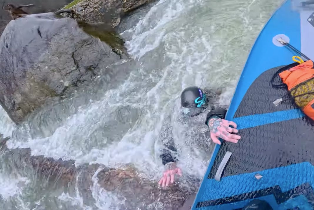 Standup paddleboarder saves kayaker with bold rescue.