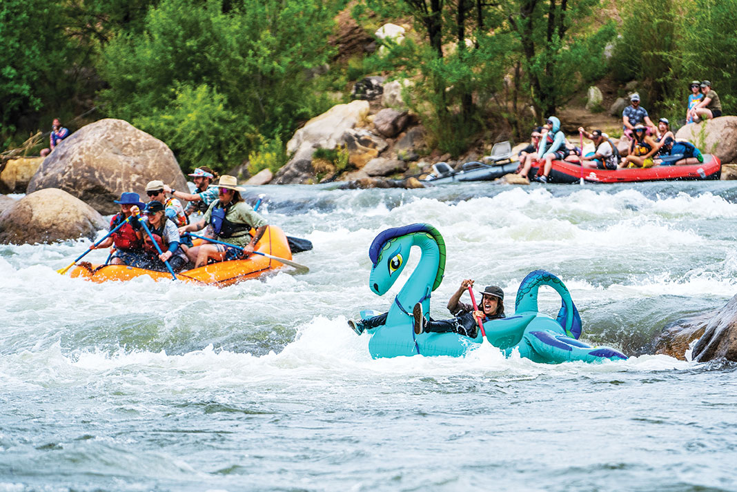 people take part in a rafting race with whimsical inflatables near 4Corners Riversports in Durango, Colorado