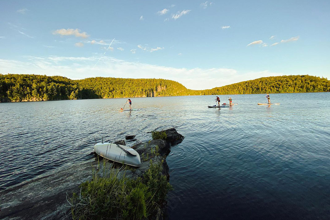 people paddleboarding on Lac Beauport in Quebec