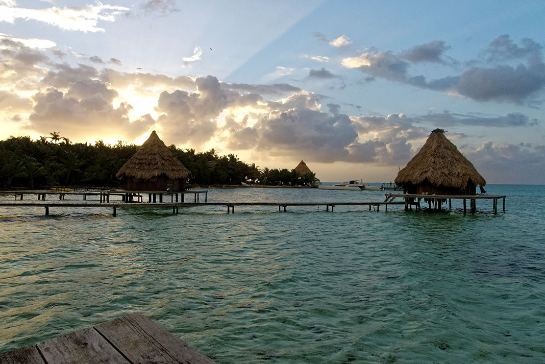 huts and water walkways at Glover's Reef in Belize