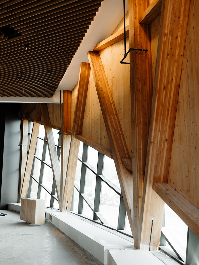 interior view of the atrium with wooden structural support beams at the new Canadian Canoe Museum