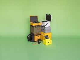 an arrangement of 9 different camping gear boxes on a green background
