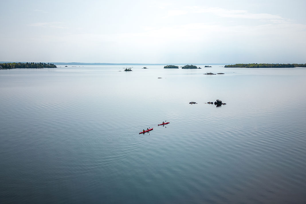 wide view of kayakers on the water in Saguenay, Quebec
