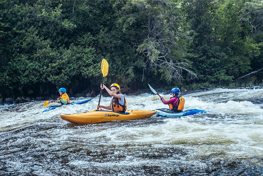 young people whitewater kayaking in the Ottawa Valley