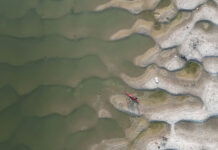 overhead view of a kayak resting on sand dunes on the banks of India's Ganges River
