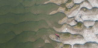 overhead view of a kayak resting on sand dunes on the banks of India's Ganges River