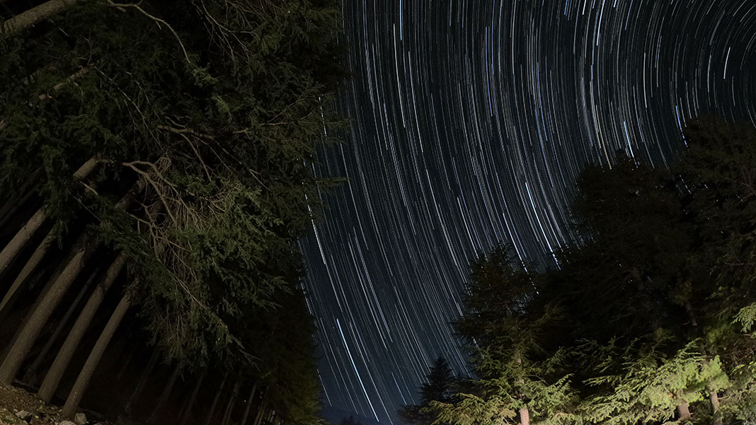 time-lapse photo of stars over campsite in India