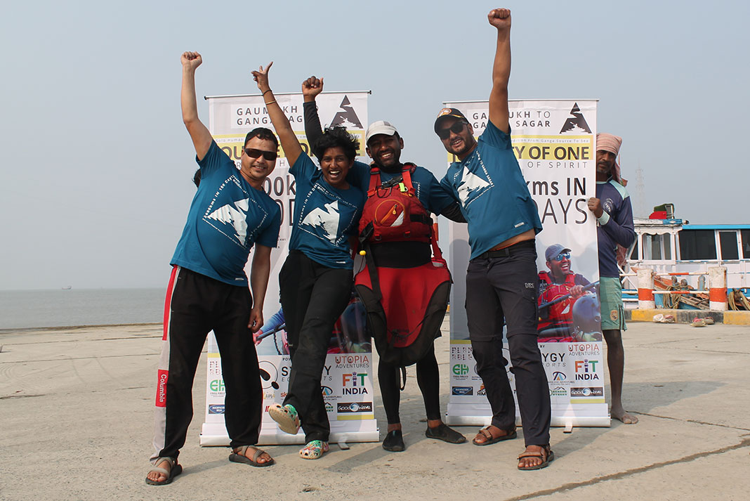 Rency Thomas and his team celebrate at the end of his Ganges River kayak expedition