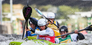 a group of paddlers compete in kayak cross in advance of its Olympics debut