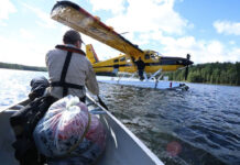 Park wardens fly out a sleeping bag filled with rotting garbage from Algonquin Park’s backcountry, left by campers who require remedial education