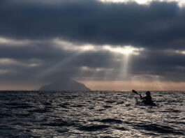 silhouetted view of Freya Hoffmeister on one of her greatest kayaking expeditions