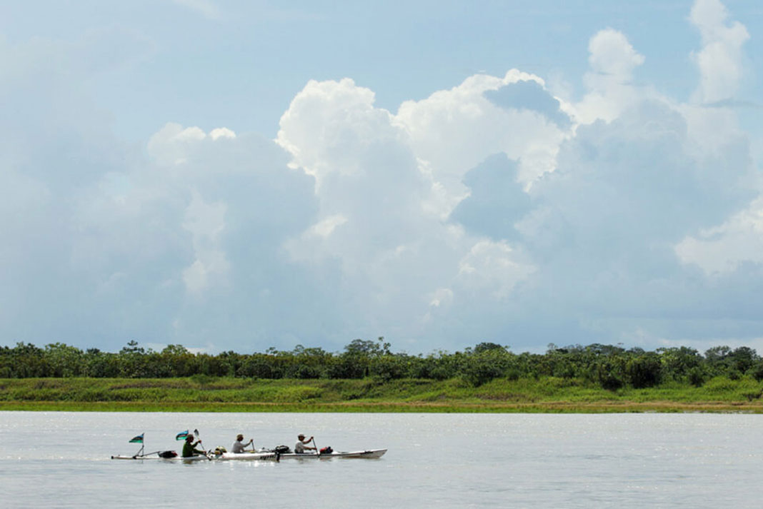 expedition kayakers paddle down the Amazon