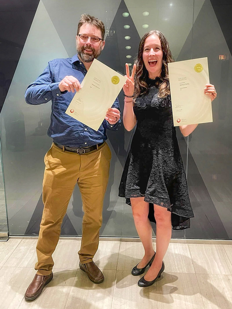 Art director Michael Hewis and editor-in-chief Kaydi Pyette celebrate with the awards certificates