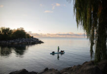 Dan Rubinstein stands silhouetted on his paddleboard during a SUP expedition that would teach him many paddling life lessons