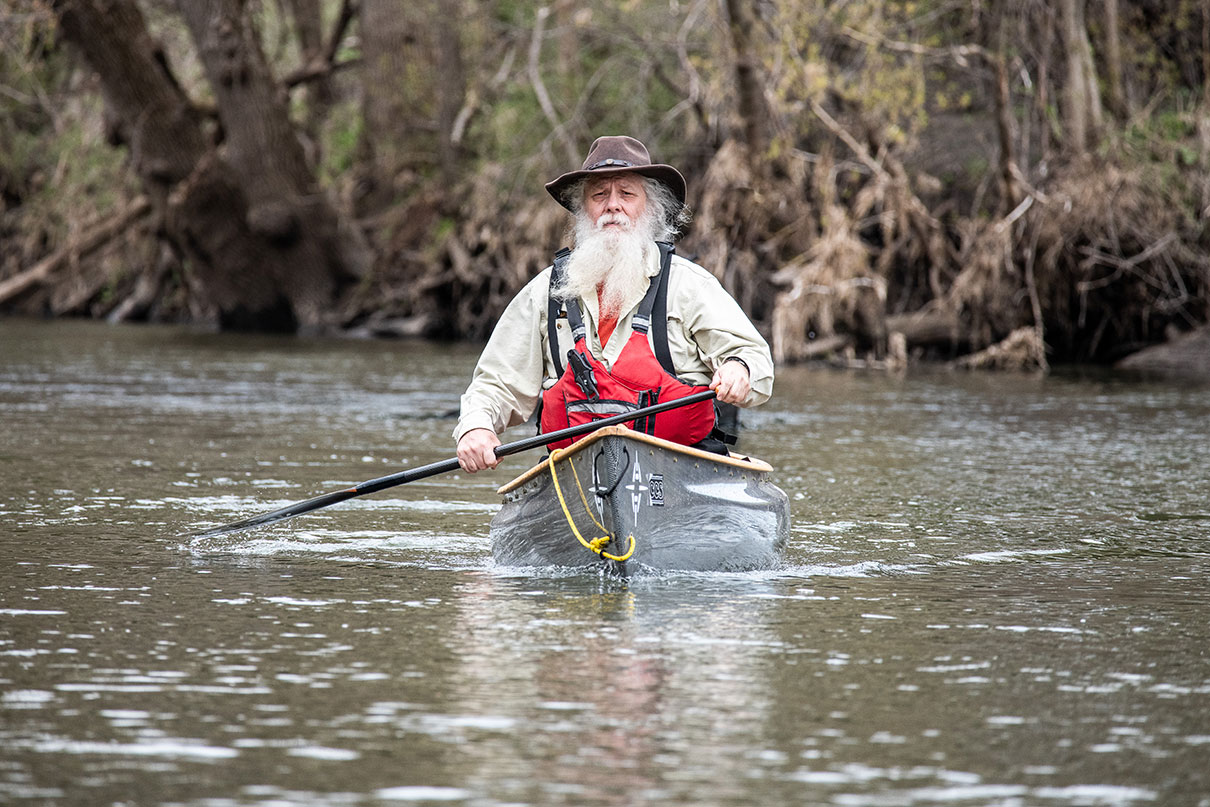 Dan Cooke photographed while paddling a canoe
