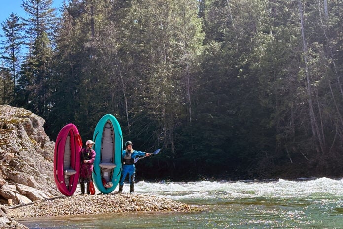 two women kayakers pose by the water with AIRE's Spud and Tater inflatable whitewater kayaks