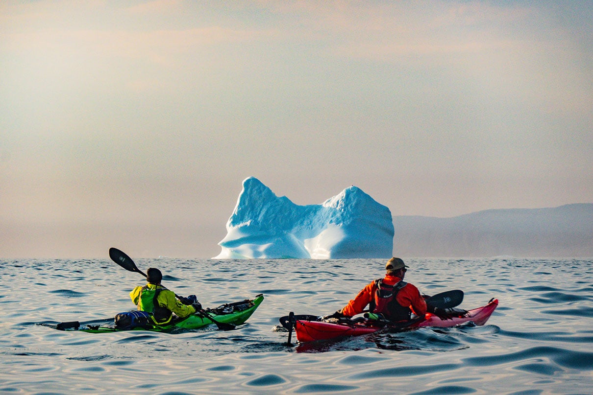 JF and Larry pass an iceberg that likely made its way from Greenland