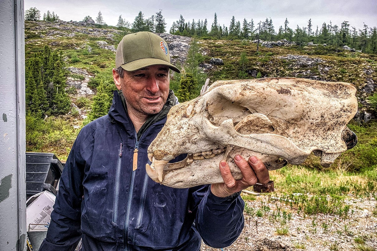 JF holds up a polar bear skull at the start of our trip