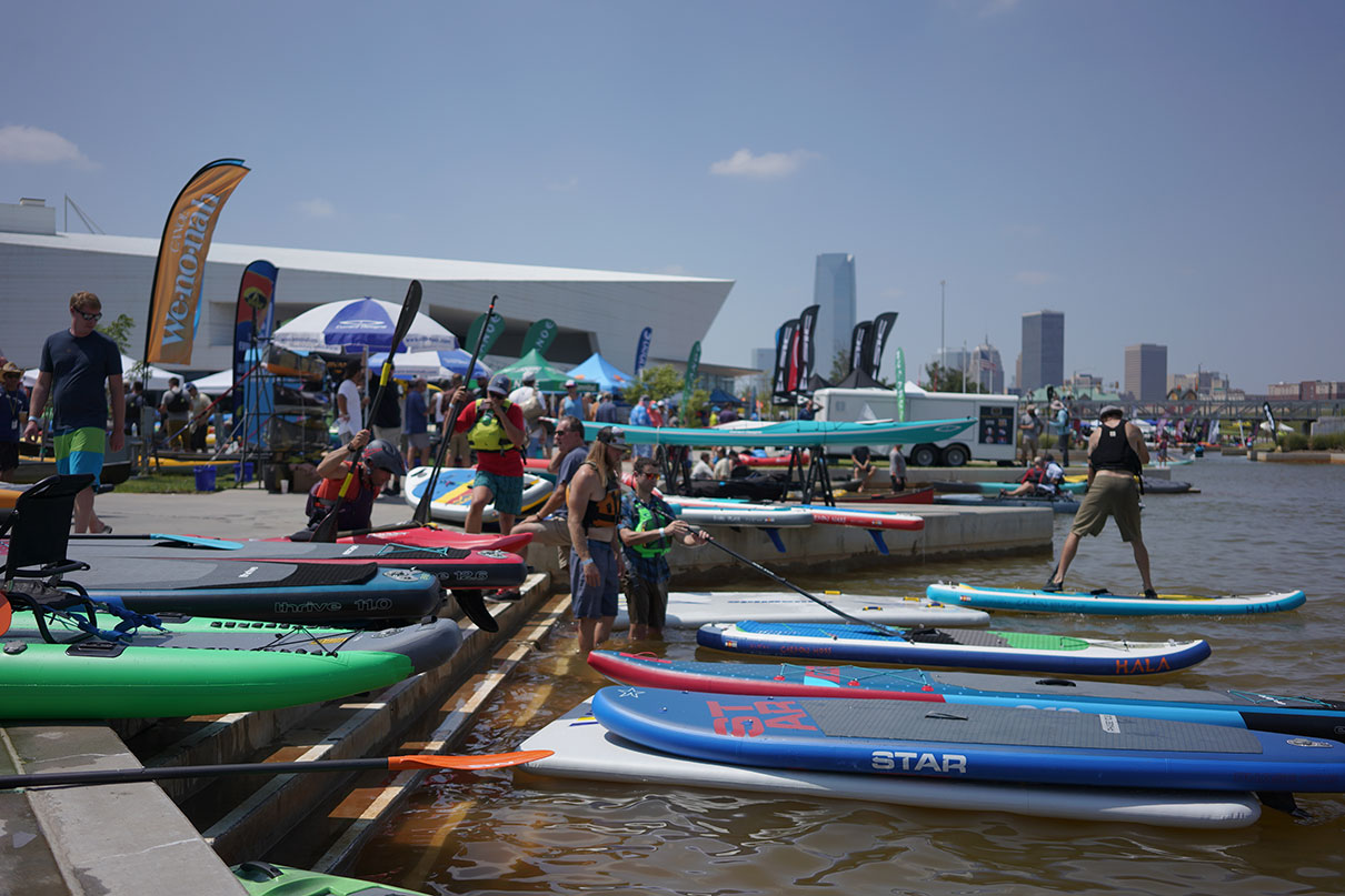 people try out demo paddlecraft at Riversport OKC during a past event